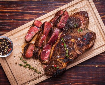 Beef Steak On A Wooden Background Free Image