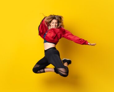 Urban Ballerina Dancing Isolated Yellow Jumping